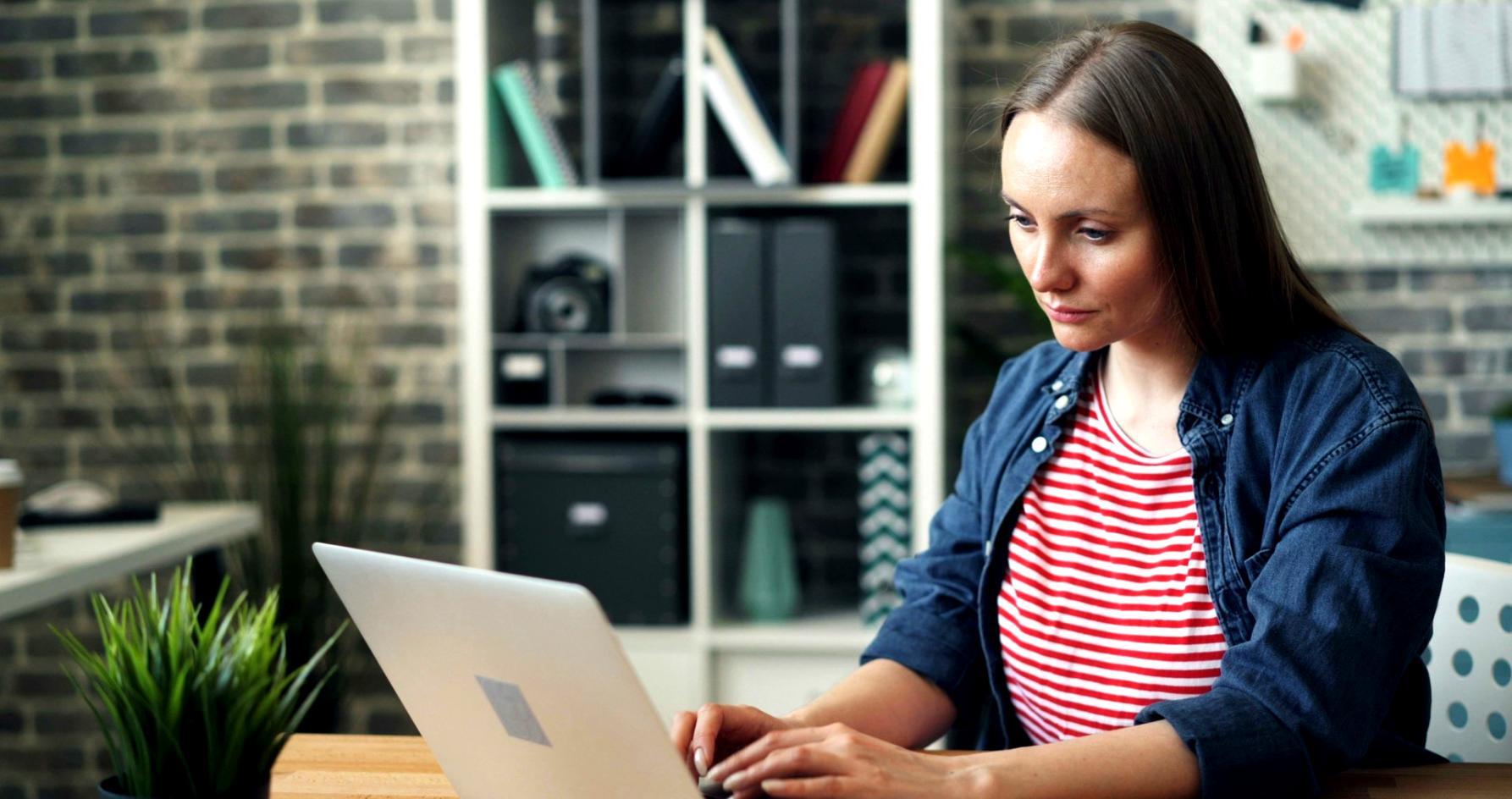 Graduate developers working on blockchain implementation at modern tech company